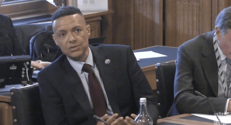 An image of Clive Lewis MP questioning David Rutley at the Environmental Audit Committee